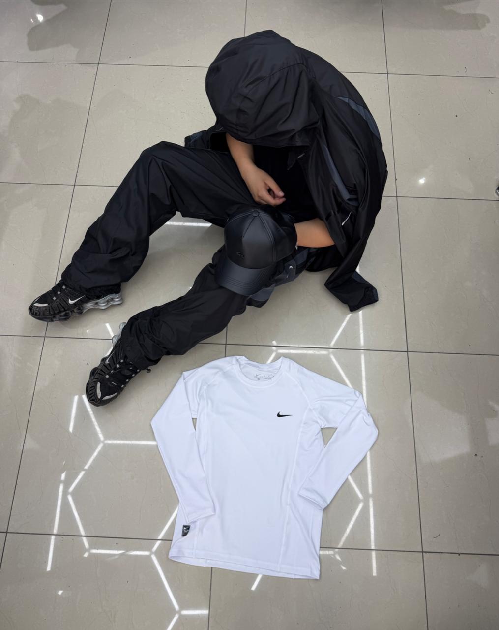 POLERA NIKE PRIMERA CAPA  BLANCO UNISEX - Imagen principal